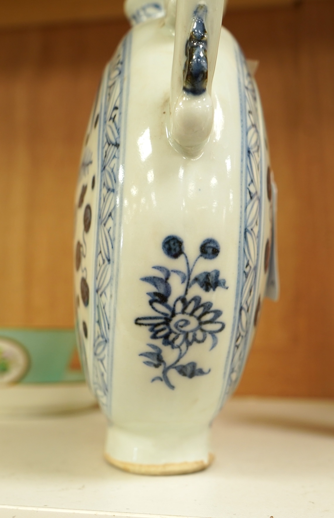 A Chinese blue and white moon flask wine pot with phoenix spout, 21cm high
